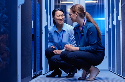 Women in a room with a computer server